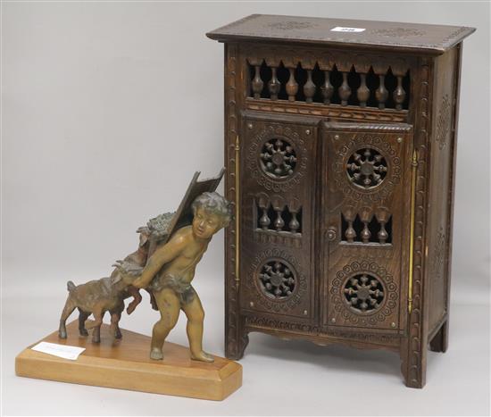 A spelter cherub group and a miniature armoire height 23cm cabinet height 36cm width 24cm